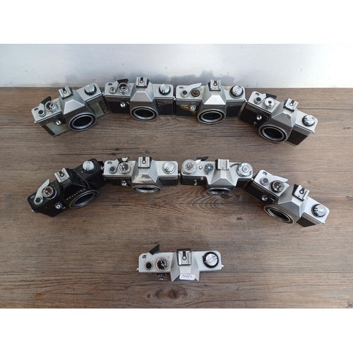 681 - Nine 35mm SLR camera bodies, eight Praktica and one Prinzflex 500E