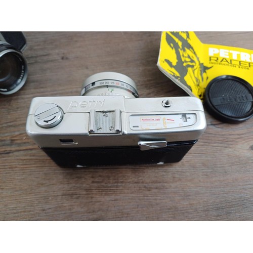 683 - Three cased Japanese 35mm rangefinder cameras, one Petri Racer with instruction manual, one Taron VR... 