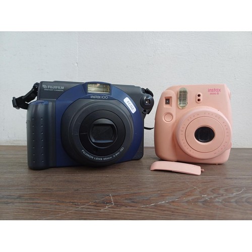 685 - Two Fujifilm Instax instant cameras, one 200 and one Mini 8 (A/F)