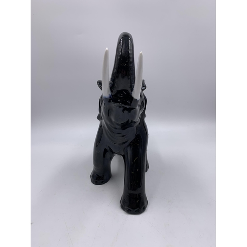 323 - A 1930s Swiss Laufen Keramik elephant figurine - approx. 24cm high