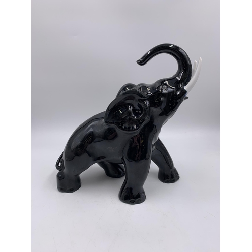 323 - A 1930s Swiss Laufen Keramik elephant figurine - approx. 24cm high