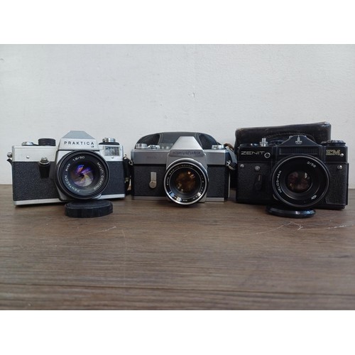 687 - Three vintage 35mm SLR cameras, one cased KMZ Zenit EM fitted with Helios-44M 2/58 lens, one cased M... 