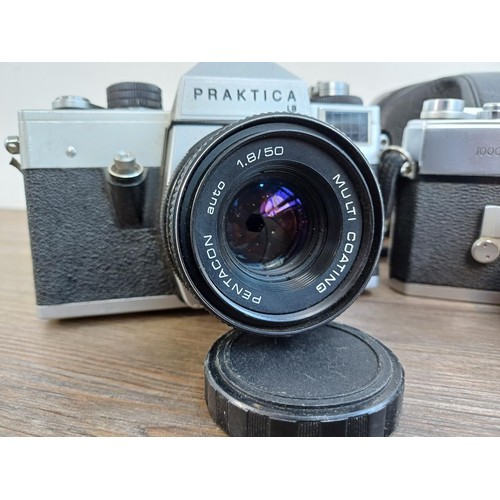 687 - Three vintage 35mm SLR cameras, one cased KMZ Zenit EM fitted with Helios-44M 2/58 lens, one cased M... 