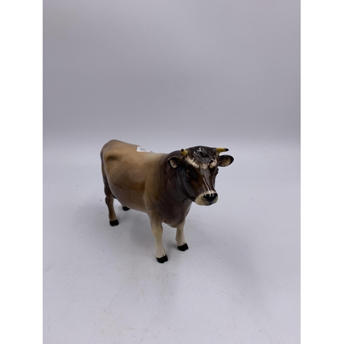 327 - Two Beswick cattle figurines, one CH. Dunsley Coy Boy no. 1422 and one Ayshire Calf