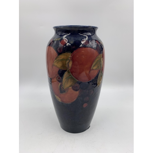 331 - A Moorcroft Pomegranate pattern vase - approx. 25cm high