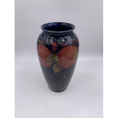 331 - A Moorcroft Pomegranate pattern vase - approx. 25cm high