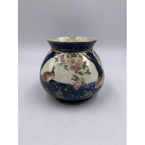 332 - An early 20th century Royal Doulton depicting rabbits and flowers - approx. 10cm high