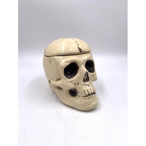 335 - A ceramic skull jar - approx. 13cm high