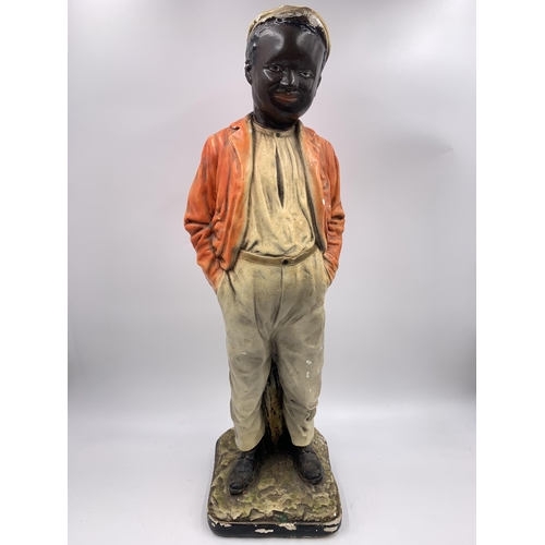 338 - A 1930s chalkware boy figurine - approx. 48cm high