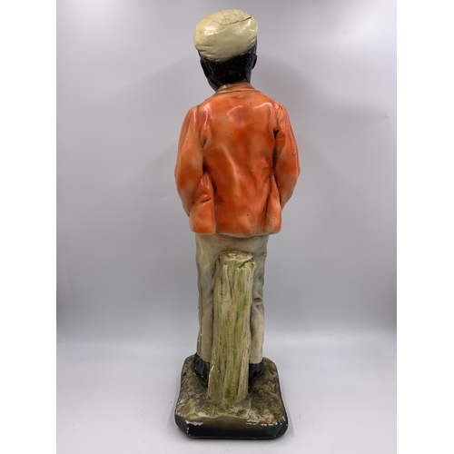 338 - A 1930s chalkware boy figurine - approx. 48cm high