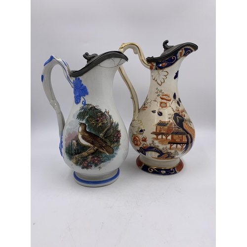 339 - Two 19th century ceramic jugs with pewter lids, one stamped C.H. Birds and one Imari style - approx.... 