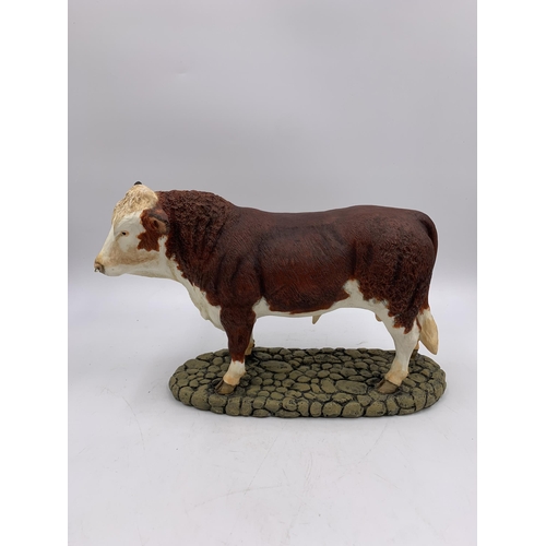 344 - A boxed Sherratt & Simpson Hereford Bull resin figurine - no. 57331