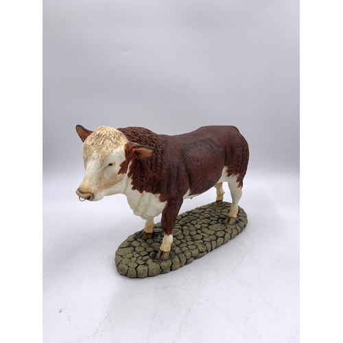 344 - A boxed Sherratt & Simpson Hereford Bull resin figurine - no. 57331