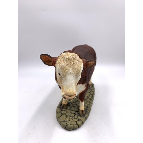 344 - A boxed Sherratt & Simpson Hereford Bull resin figurine - no. 57331