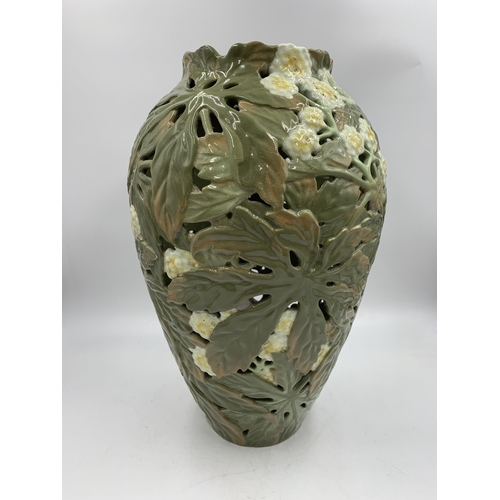 345 - A Japanese earthenware pierced vase decorated with chrysanthemum flowers with seal mark to base (pos... 