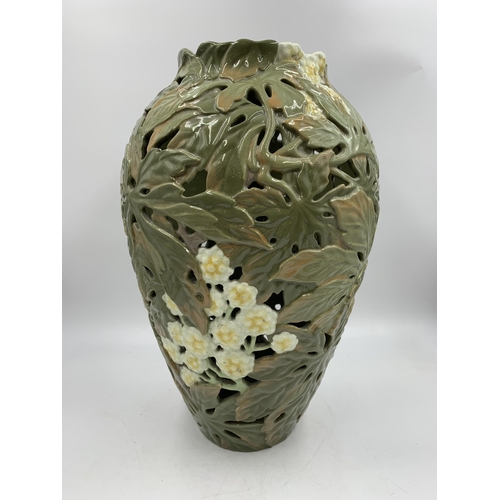 345 - A Japanese earthenware pierced vase decorated with chrysanthemum flowers with seal mark to base (pos... 