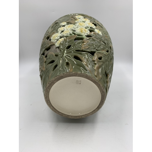 345 - A Japanese earthenware pierced vase decorated with chrysanthemum flowers with seal mark to base (pos... 