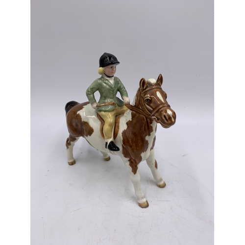 353 - Four ceramic figurines, two Beswick kittens, one Beswick Girl on Pony no. 1499 and one Lladro Happy ... 