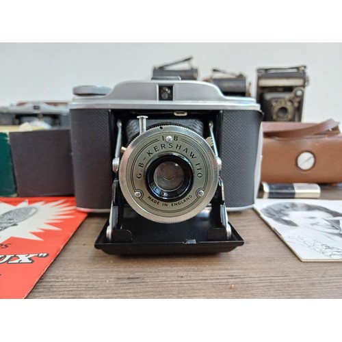 689 - A collection of folding cameras to include boxed G.B. Kershaw 110, cased Zeiss Ikon Nettar 517/16, K... 