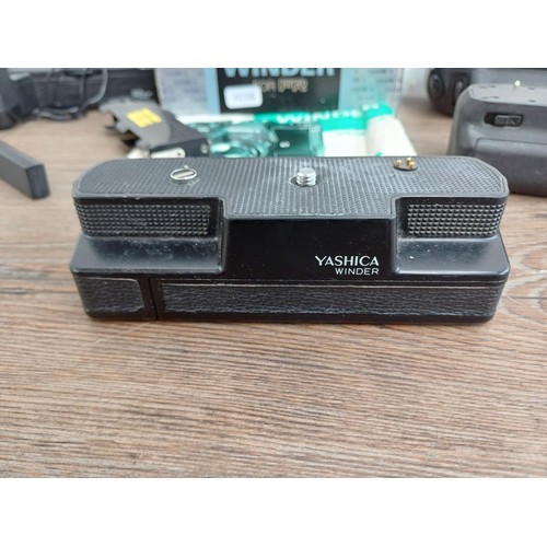 691 - Five items to include boxed Yashica Winder for FR with instruction manual, battery grip for Nikon D7... 