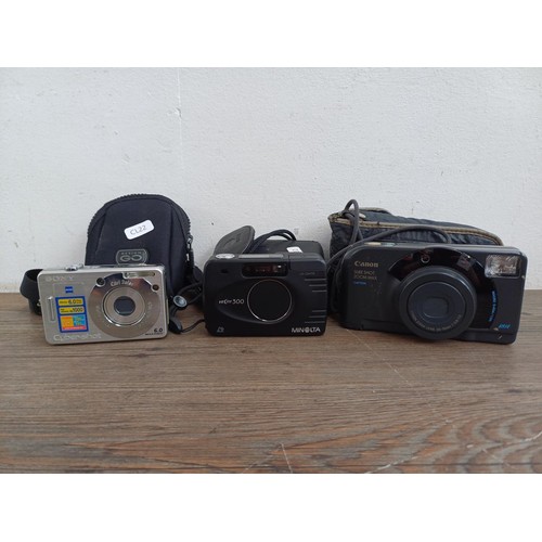 692 - Three cased cameras, one Sony DSC-W50 6mp compact digital, one Minolta Vectis 300 for APS film and o... 