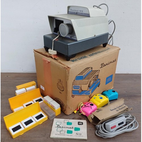 693 - A boxed Braun Paximat N12 slide projector with remote control, boxed slides and three SupaSnaps sing... 