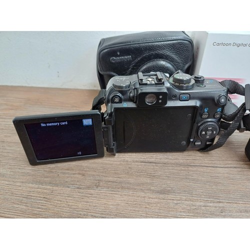 698 - A collection of digital cameras to include cased Canon PowerShot G11 10mp compact, Canon G16 12.1mp ... 