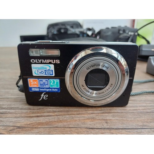 698 - A collection of digital cameras to include cased Canon PowerShot G11 10mp compact, Canon G16 12.1mp ... 