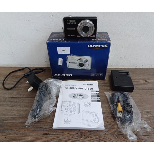 699 - A boxed Olympus FE-330 8mp compact digital camera with accessories and instruction manual