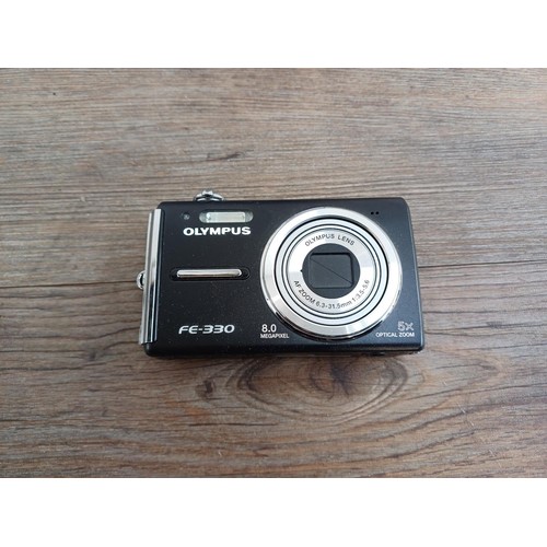 699 - A boxed Olympus FE-330 8mp compact digital camera with accessories and instruction manual