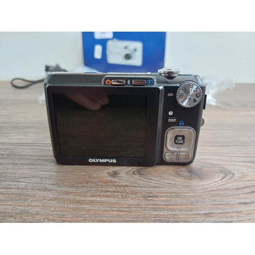 699 - A boxed Olympus FE-330 8mp compact digital camera with accessories and instruction manual