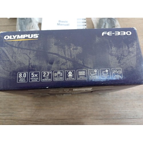 699 - A boxed Olympus FE-330 8mp compact digital camera with accessories and instruction manual