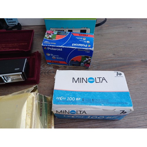 700 - A collection of boxed cameras to include Minolta Riva AF35EX, ITT MagicFlash, cased Halina 3000, Mir... 