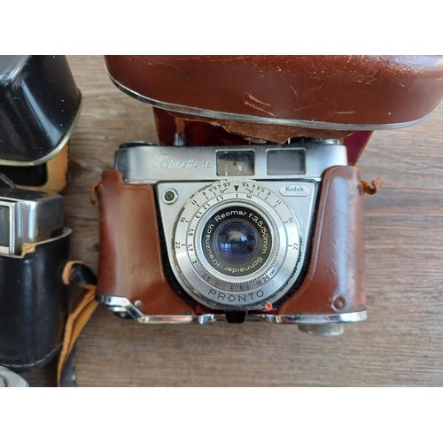 703 - A collection of vintage cameras to include Kodak Brownie Reflex pseudo TLR, Zeiss Ikon Contina 1a 52... 