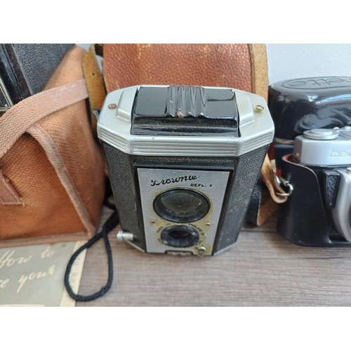 703 - A collection of vintage cameras to include Kodak Brownie Reflex pseudo TLR, Zeiss Ikon Contina 1a 52... 