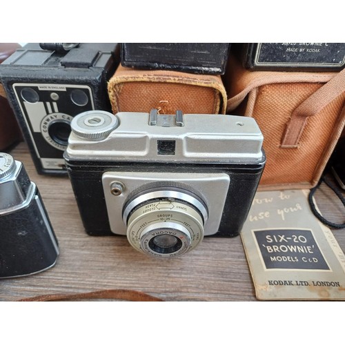 703 - A collection of vintage cameras to include Kodak Brownie Reflex pseudo TLR, Zeiss Ikon Contina 1a 52... 