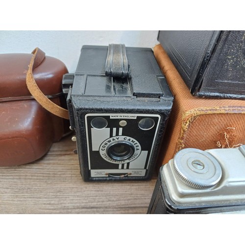 703 - A collection of vintage cameras to include Kodak Brownie Reflex pseudo TLR, Zeiss Ikon Contina 1a 52... 