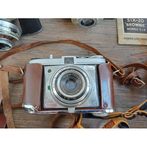 703 - A collection of vintage cameras to include Kodak Brownie Reflex pseudo TLR, Zeiss Ikon Contina 1a 52... 