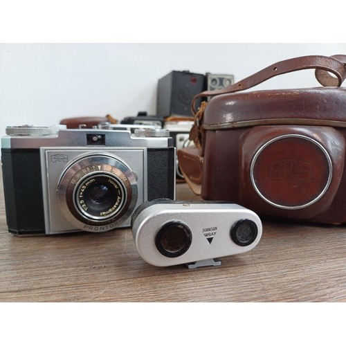 703 - A collection of vintage cameras to include Kodak Brownie Reflex pseudo TLR, Zeiss Ikon Contina 1a 52... 