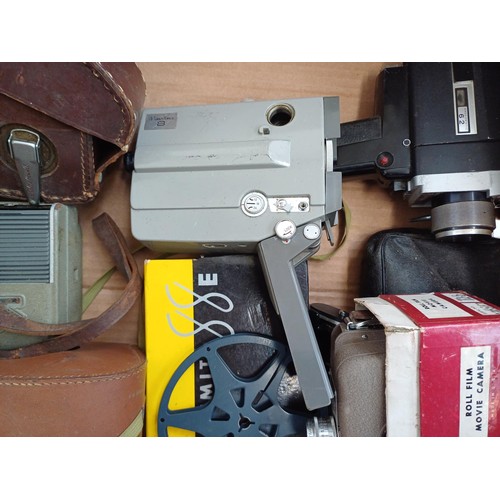 707 - A collection of cine cameras to include Yashica, DeJUR, Bell & Howell, boxed Ricohmite 88E etc.