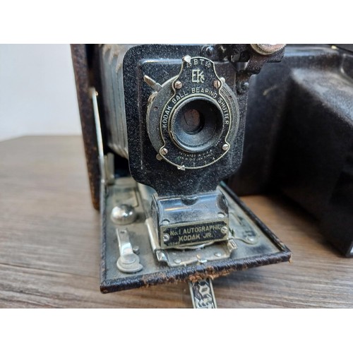 710 - Four items, one Kodak No.1 Autographic Jr. folding camera for 120 film, one cased Olympus AFL-T Quar... 