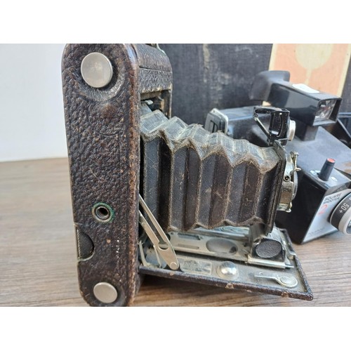 710 - Four items, one Kodak No.1 Autographic Jr. folding camera for 120 film, one cased Olympus AFL-T Quar... 