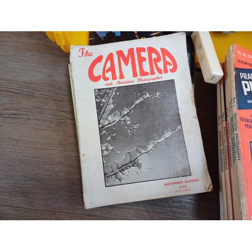 711 - Three boxes containing a large collection of photography magazines to include Leica Fotographia and ... 