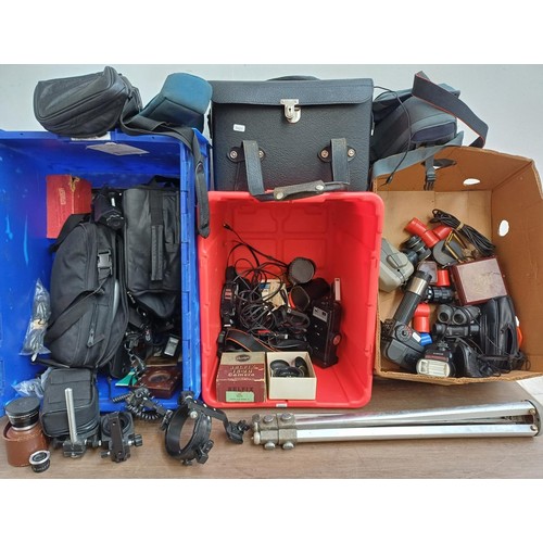 712 - Three boxes containing a large quantity of optical and photography accessories to include cases, len... 