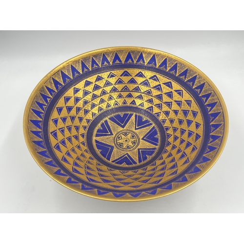 370 - A Mary Rich studio pottery circular footed fruit bowl on cobalt blue ground with gilt geometric patt... 