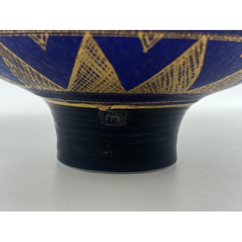 370 - A Mary Rich studio pottery circular footed fruit bowl on cobalt blue ground with gilt geometric patt... 