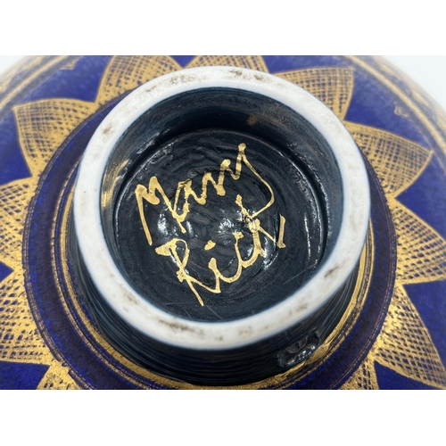 370 - A Mary Rich studio pottery circular footed fruit bowl on cobalt blue ground with gilt geometric patt... 