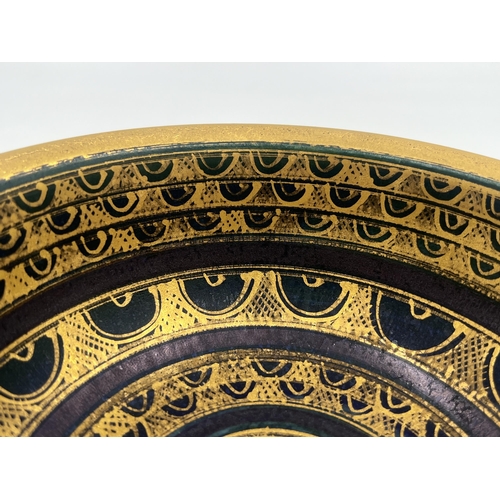 373 - A Mary Rich studio pottery circular footed bowl on teal and plum ground with gilt geometric pattern ... 