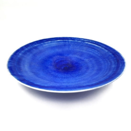 377 - A Mary Rich studio pottery circular footed dish with ultramarine and teal glaze - approx. 20.5cm dia... 