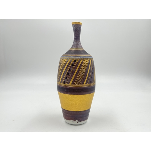 378 - A Mary Rich studio pottery solifleur vase on damson ground with gilt geometric pattern - approx. 17.... 